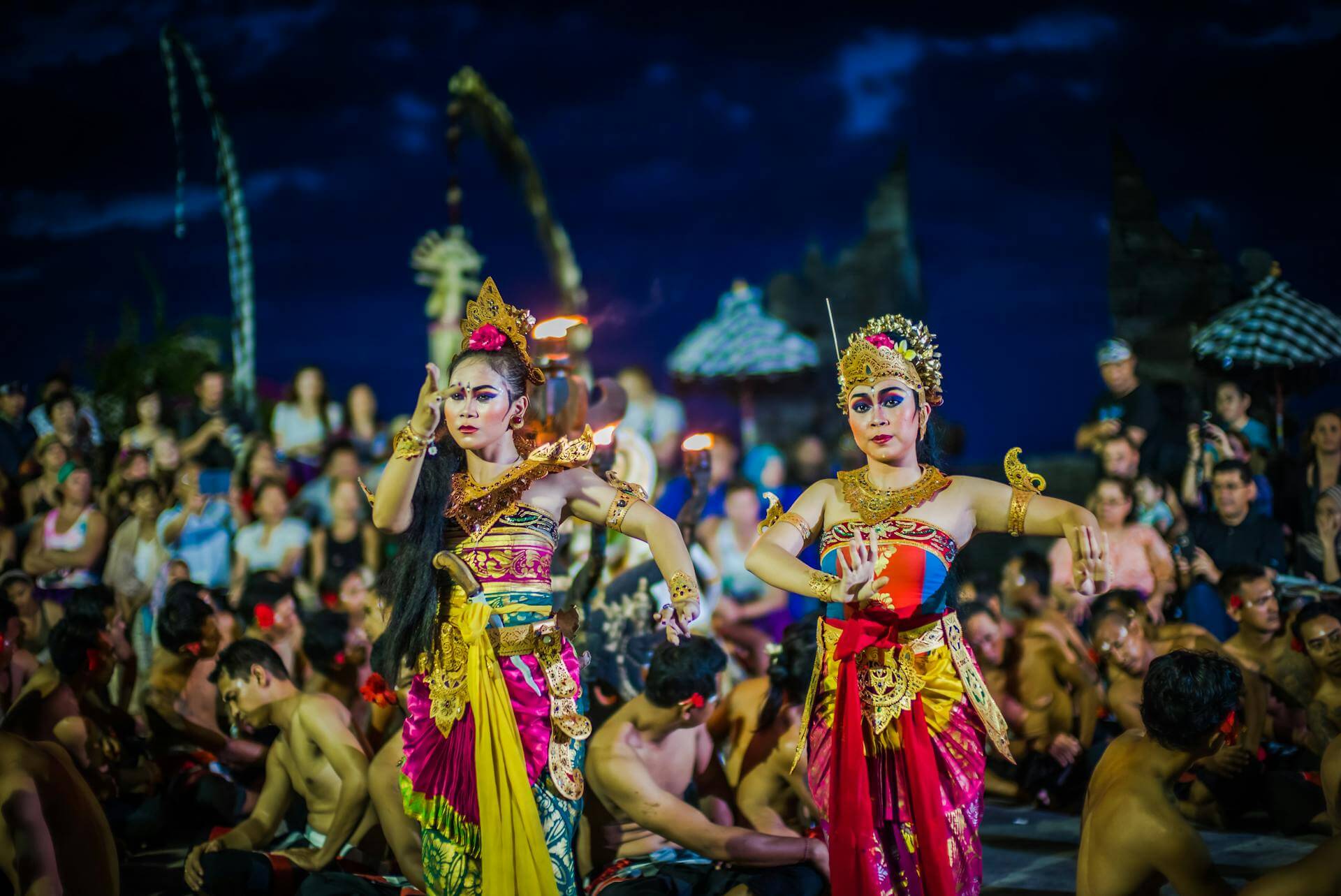 Two women performing traditional Balinese dance